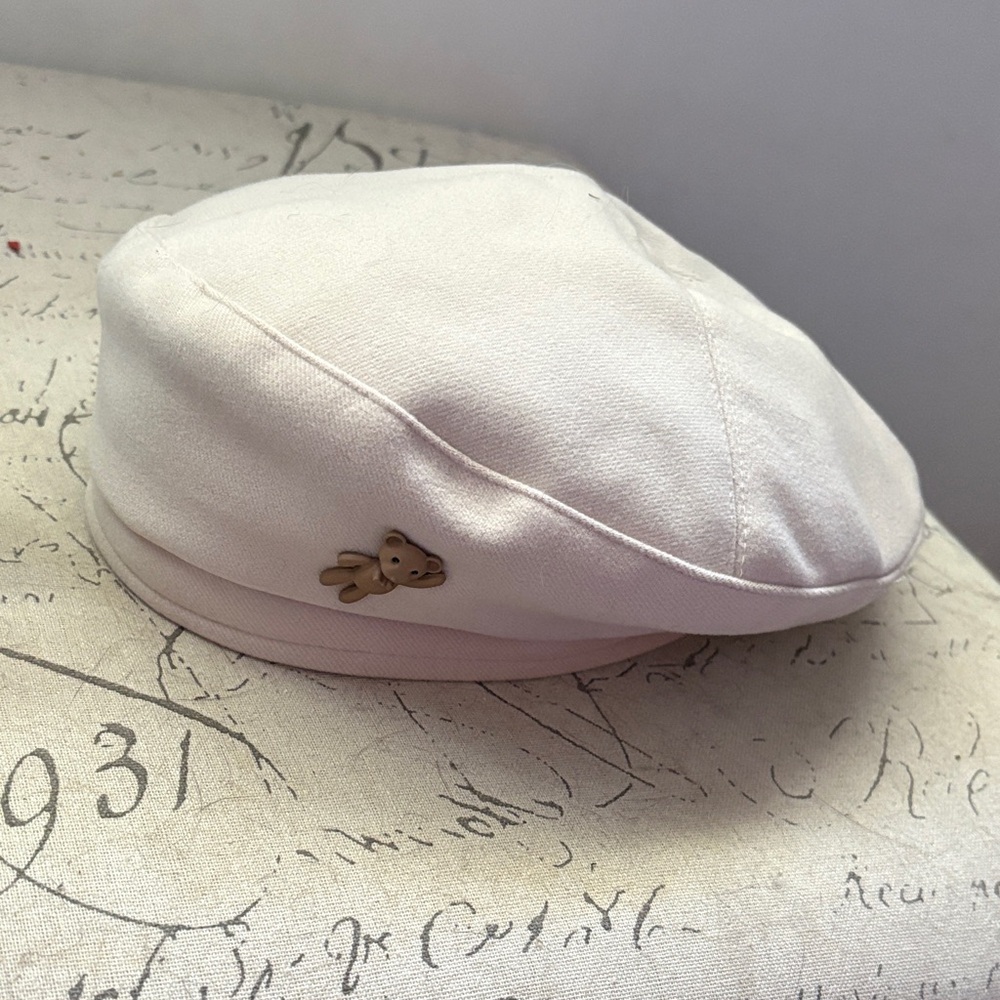 Ivory Baker Boy Cap with Bear Accessory